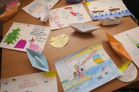 Children's drawings and paper boats