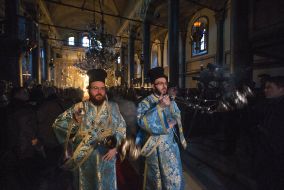 Priests with incense during the solemn liturgy