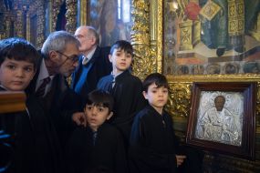 A man looks at the icon during a solemn liturgy on the occasion of the giving of Thomas