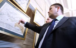 Pavlo Klimkin is studying a copy of the old map of Ukraine
