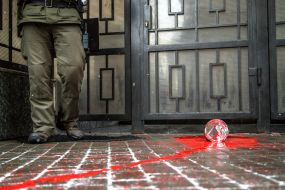 Red paint on the road near the building of the Consulate General of the Russian Federation