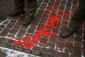 Red paint on the road near the building of the Consulate General of the Russian Federation