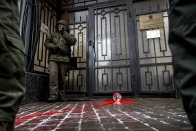 Red paint on the road near the building of the Consulate General of the Russian Federation