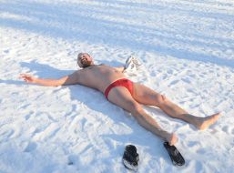 Man lying on the snow