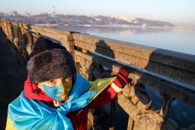 Boy with the flag of Ukraine, painted on the face