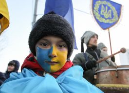 Boy with the flag of Ukraine, painted on the face
