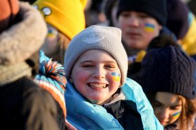 Boy with the flag of Ukraine, painted on the cheek