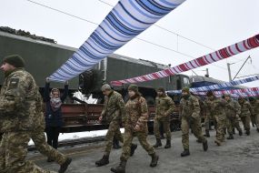 Servicemen go under women's towels