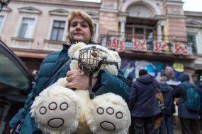 The girl holds the toy