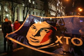 Banner with the image of activist Katerina Gandzjuk