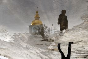 The display of the dome of the bell tower is St. Michael's Golden-Domed Monastery in the puddle