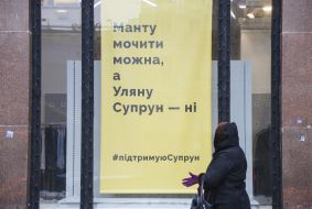 A poster in a shop window in support of Ulyana Suprun