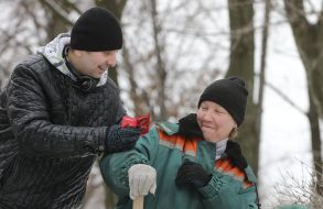 An activist gives condoms to a communal worker