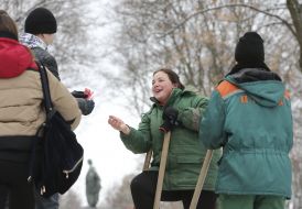 An activist gives condoms to a communal worker