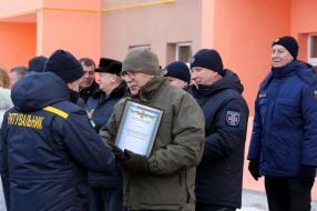 Serhiy Yarovyy handles an order for an apartment to an employee of the DSNC