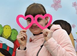 Girl with glasses in the form of hearts