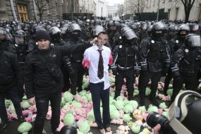 Toy pigs near police officers