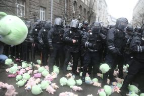 Toy pigs near police officers