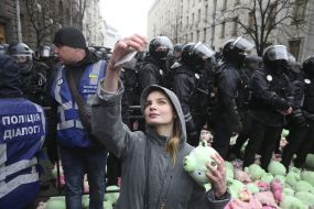 Toy pigs near police officers