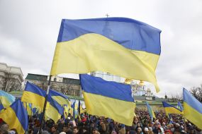 People hold the flags of Ukraine