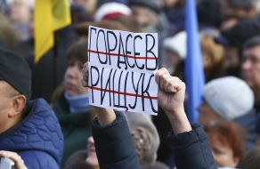 A man holds a poster