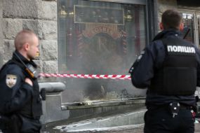 Law enforcers at the shop window "Roshen"