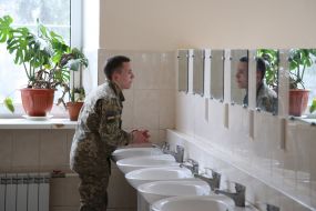 Lyceum cleans hands in the toilet