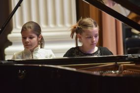 Girls play piano