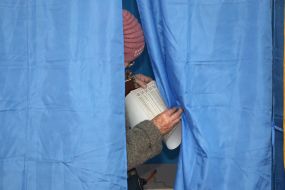 A woman in a polling booth
