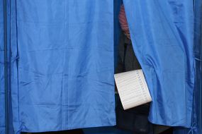 A woman in a polling booth