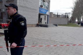 The law-enforcement guard patrols the fenced territory of the company "Iskra"
