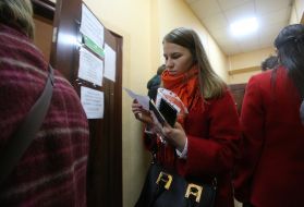 Girl holds documents