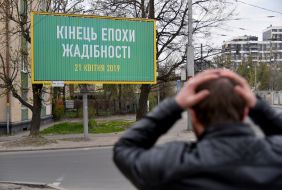 Billboard with the words "The end of the era of greed"