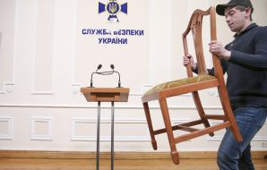 A man carries a chair