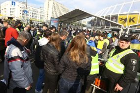 People at the entrance to the NSC "Olympic"