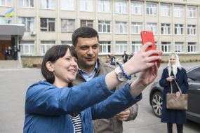 The girl makes a selfie with Volodymyr Groysman