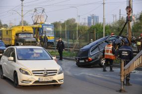 Rescuers remove car from light rail fencing