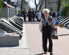 Laying flowers on the alley with busts of Heroes of Chernobyl