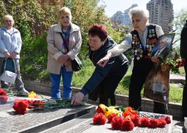 Laying flowers on the alley with busts of Heroes of Chernobyl