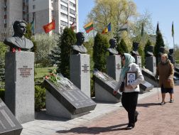 Laying flowers on the alley with busts of Heroes of Chernobyl