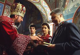 Metropolitan Epiphanius and Petro Poroshenko with his wife Marina