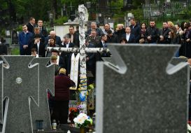 Laying flowers at the graves of heroes at the Lychakiv Cemetery