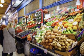 People choose fruits on the central covered market