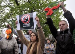 The activists of the "Svitanok" NGO hold funeral wreaths