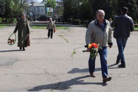 People bring flowers to the House of Trade Unions in Odessa