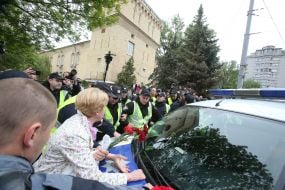 Law enforcers help drive a car