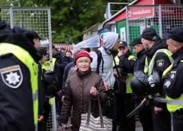 Woman passes through the police cordon