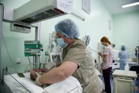 A woman cares for babies at the Center for Pediatric Cardiology and Cardiac Surgery