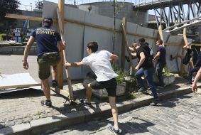 The activists destroy the fence