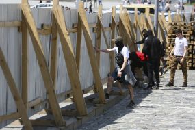 The activists destroy the fence